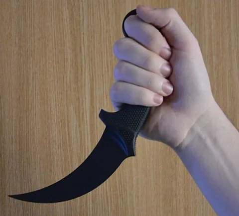 karambit: a small, curved Southeast Asian knife resembling a Sumatran tiger's claw