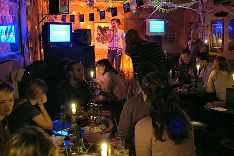 karaoke: a form of entertainment popular in clubs, at parties, etc, in which individual members of the...