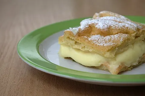 karpatka: a traditional Polish cream pie with some sort of vanilla buttercream filling—aerated butter mixed...