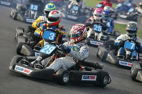 karting: an open-wheeled motorsport that uses small vehicles called karts or go-karts