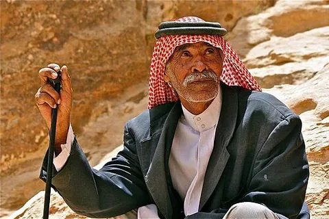 keffiyeh: an Iraqi headdress from the city of Kufa that is traditionally worn by some Arabs, also used as a...