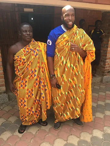 kente: a type of fabric made of interwoven cloth strips, native to Ghana