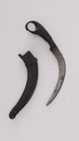 kerambit: a small, double-edged, curved Southeast Asian knife, with a finger ring, resembling a tiger's claw