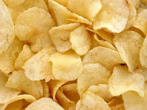 kettle chip: a potato chip made in a small batch in oil that, at the start of the batch's cooking, is not very...