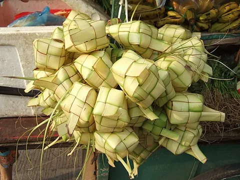 ketupat: an Asian dumpling made from rice wrapped in a woven palm-leaf pouch and boiled