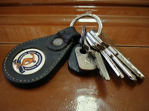 keychain: a chain or ring to which a key may be attached