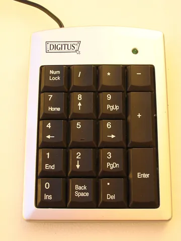 keypad: a small board with keys primarily used for tactile input into a machine