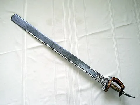 khanda: a double-edged sword from India, used ceremonially in Sikhism
