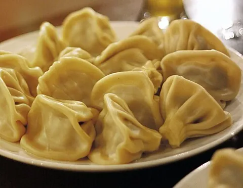 khinkali: a Georgian dumpling made of twisted knobs of dough stuffed with spiced meat, fish, or vegetables