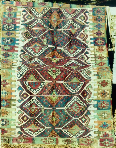 kilim: a flat tapestry-woven carpet or rug from Turkey or Kurdistan