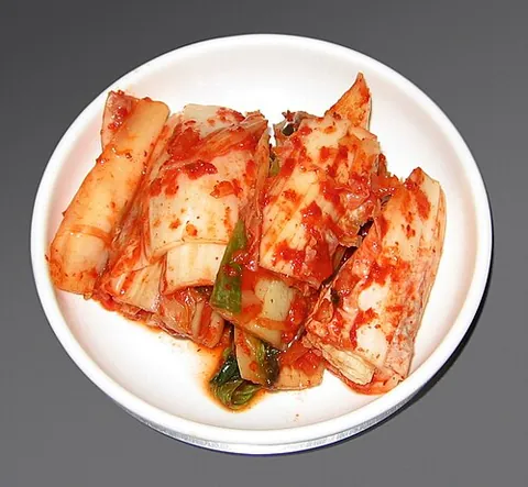 kimchi: a Korean dish made of vegetables, such as cabbage or radishes, that are salted, seasoned, and...
