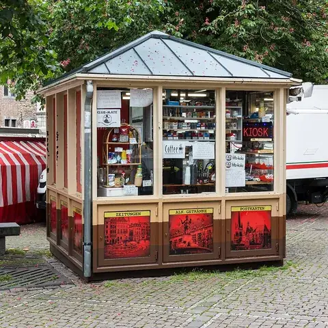 kiosk: a small enclosed structure, often freestanding, open on one side or with a window, used as a booth...
