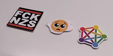 kiss-cut: of a sticker: cut so that the sticker is shaped but the backing is intact