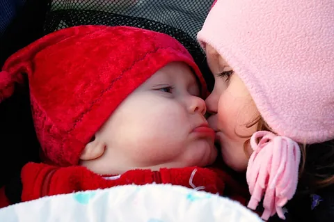 kiss: to touch with the lips or press the lips against, usually to show love or affection or passion, or...