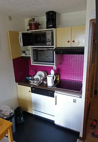 kitchenette: a small kitchen or area for preparing food, often just a part of a room