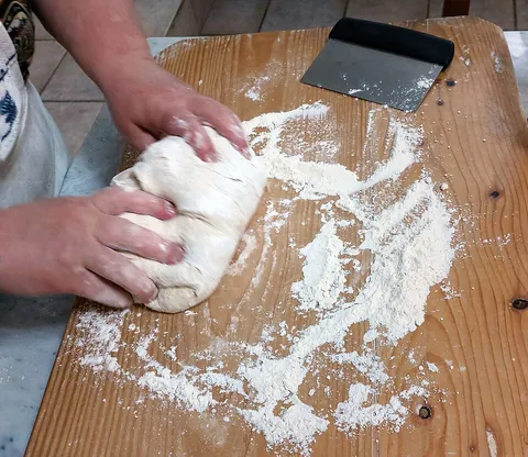 knead: to work and press into a mass, usually with the hands; especially, to work, as by repeated pressure...