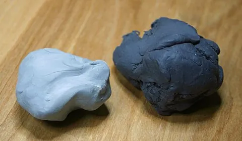 kneaded eraser: a tool made from pliable material resembling putty or chewing gum that is used to absorb graphite...