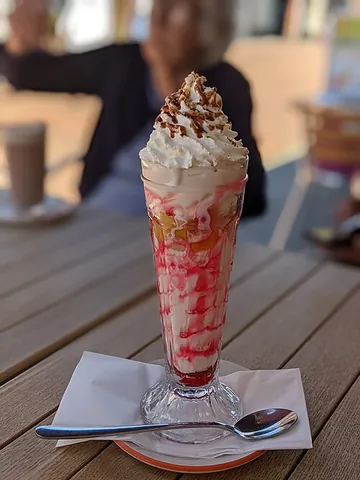 knickerbocker glory: an elaborately-layered ice cream sundae served in a tall glass