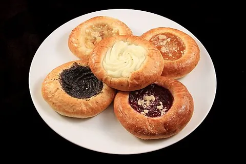 kolach: a type of pastry that holds a portion of fruit or cheese, surrounded by a puffy cushion of supple...