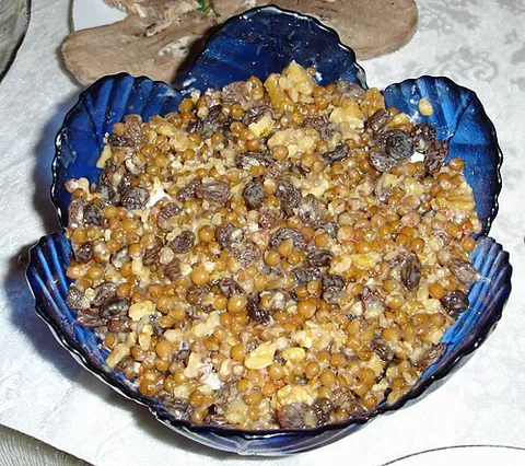 koliva: a dish made of sweetened boiled wheat, optionally mixed with nuts and spices, and used in Eastern...