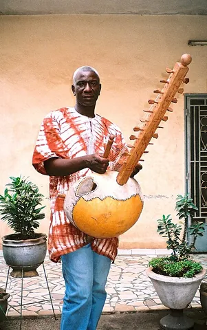 kora: a type of harp or lute played in West Africa