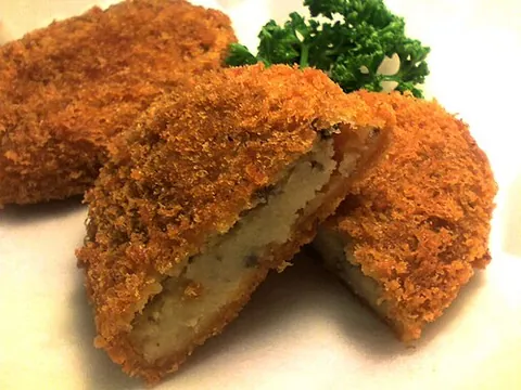 korokke: a Japanese dish of chopped meat, seafood, or vegetables with mashed potato or white sauce, rolled...