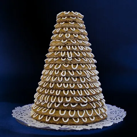 kransekage: a cake constructed from a stack of rings of decreasing diameter, each made of marzipan, egg whites...