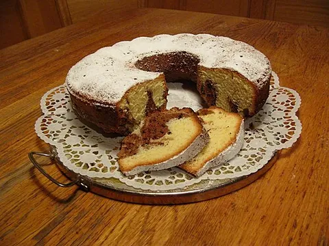 kuchen: any of several types of cake, typically eaten with coffee