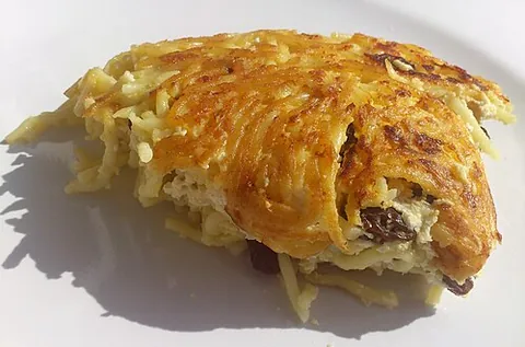 kugel: a traditional savoury or sweet Jewish dish consisting of a baked pudding of pasta, potatoes, or...