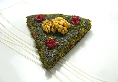 kuku: an Iranian dish somewhat resembling a quiche or omelette