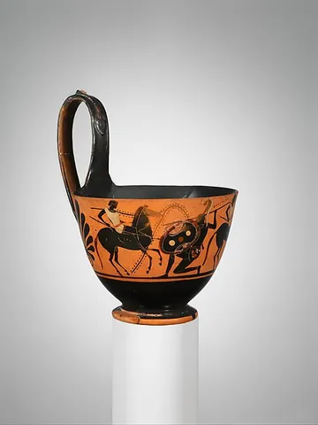 kyathos: a style of painted Greek vase with a single long flat looping handle resembling a ladle
