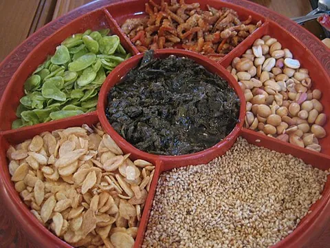 lahpet: a dish, popular in Burma, consisting of pickled or fermented tea leaves (encountered in the West...