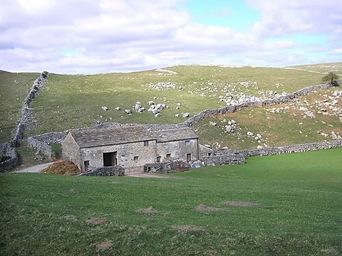 laithe house: a dwelling with other farm buildings, including a barn, as a single structural unit, with separate...