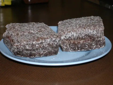 lamington: a small square Australian/New Zealand cake made with sponge cake covered on all sides (including...