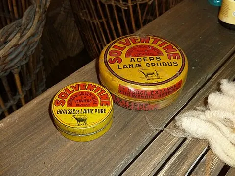 lanolin: a greasy yellow substance chemically akin to wax that is secreted from wooly animals, with a...