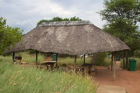 lapa: an open structure in South Africa, typically a thatched roof supported by wooden poles