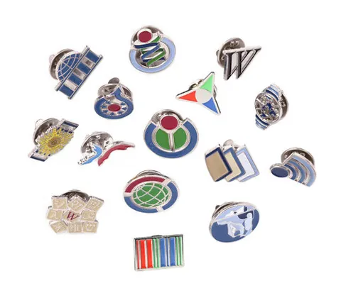 lapel pin: a simple accessory that can be attached to clothing with a pin or fastener, often round and bearing...
