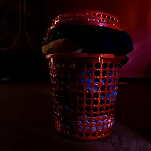 laundry basket: a container, often made of plastic, for holding and transporting clothing and household textiles,...