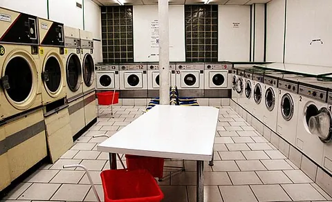 laundry: a laundering; a washing
