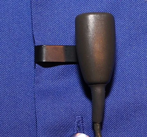 lavalier microphone: a small microphone worn like a lavalier (suspended from a cord worn around the neck)