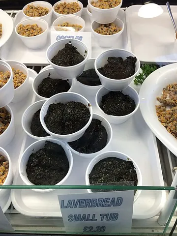 laverbread: a traditional Welsh delicacy of boiled laver, coated with oatmeal and fried