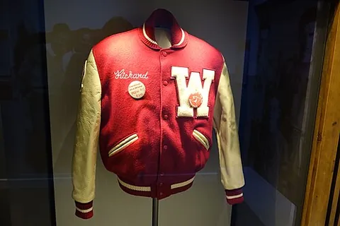 letter jacket: a jacket traditionally worn by high-school and college students to represent school and team pride...