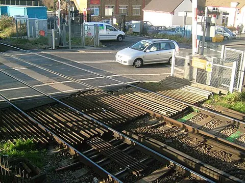 level crossing: an at-grade crossing between a railway line and an ordinary road, with rails and road at the same...