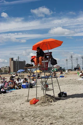 lifeguard: a lifesaver: a rescuer, usually an expert swimmer, employed to save swimmers in trouble or near...
