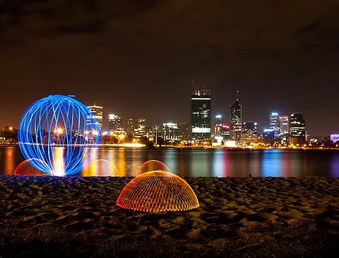 light painting: the artistic technique of moving a light source to selectively illuminate parts of the subject or...