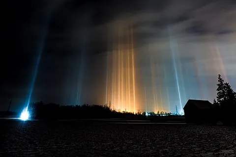 light pillar: a visual phenomenon created by the reflection of light from ice crystals with near-horizontal...