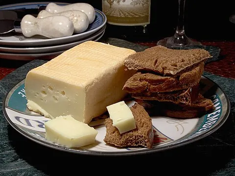 limburger cheese: a creamy, soft cheese with a mild taste and a pungent odor