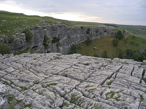 limestone pavement: a natural karst landform consisting of a flat limestone slabs (clints) separated by fissures...