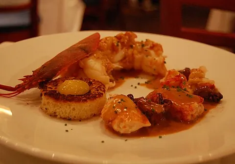 lobster newberg: an American seafood dish made from lobster, butter, cream, cognac, sherry, and eggs, seasoned with...