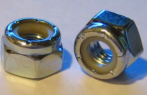 locknut: a nut with an inner ring made of a material with elastic properties to prevent it from slipping